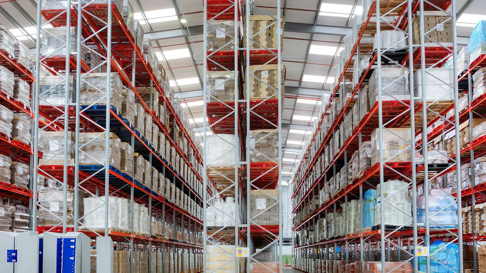 Tall pallet racking in a bright wholesale warehouse