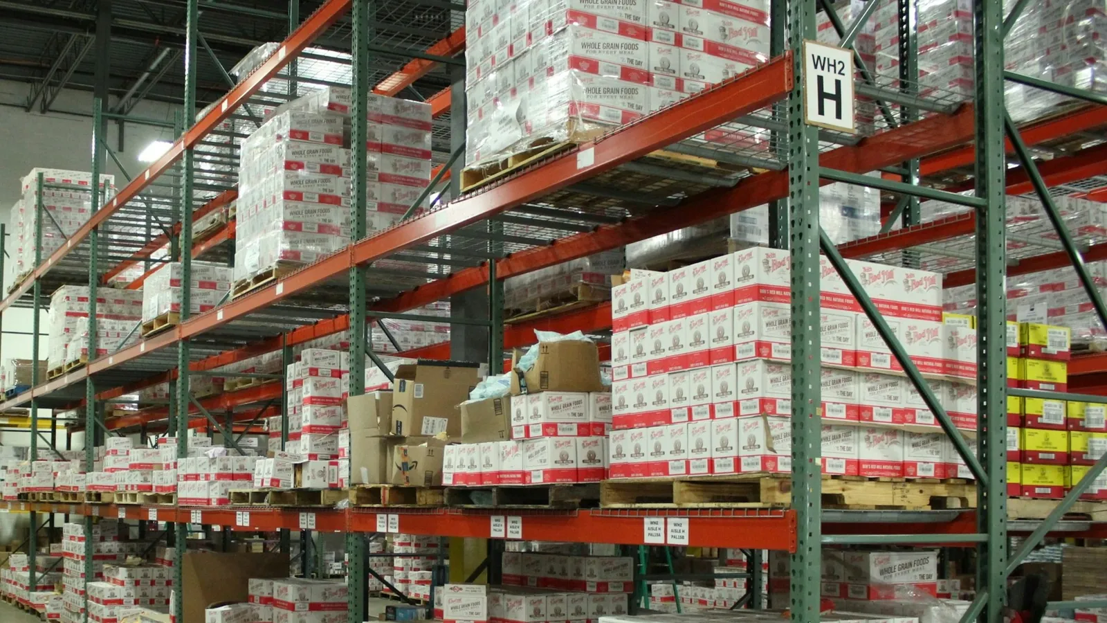 Warehouse shelving stacked with boxed stock