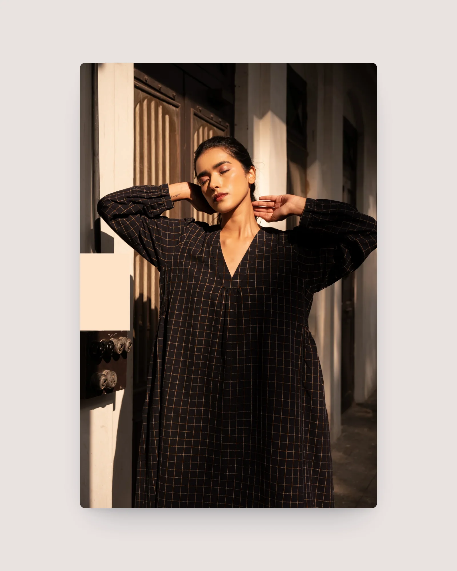 Model wearing a navy check handwoven Sahana dress