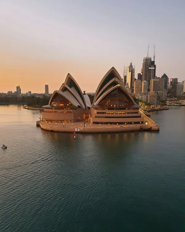 Sydney Opera House and city skyline at golden hour